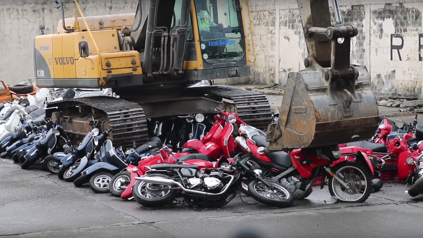 Excavator Crushing Motorcycles