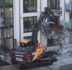 Man Destroys Building